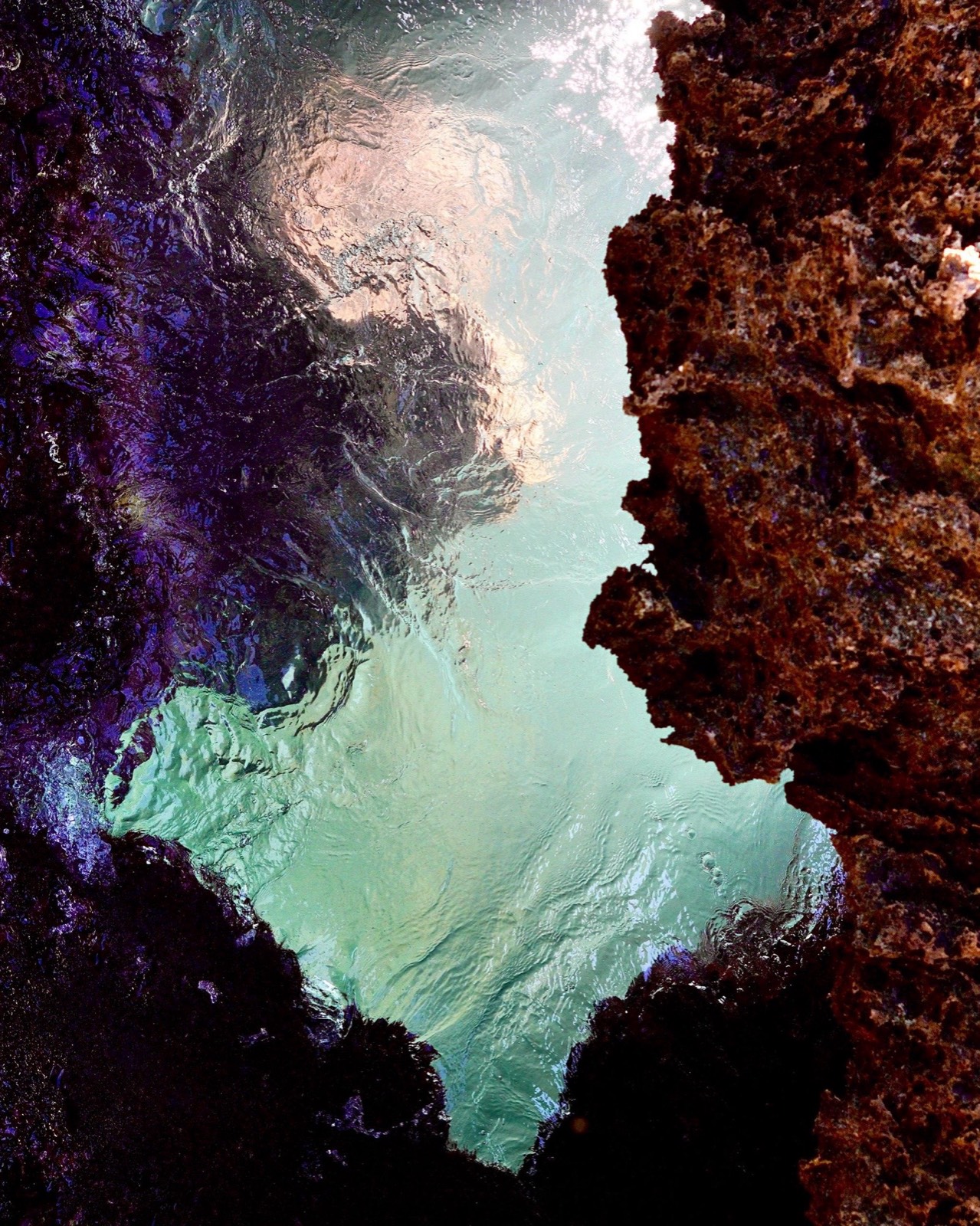 Aquamarine tidepool set in dark lava rock